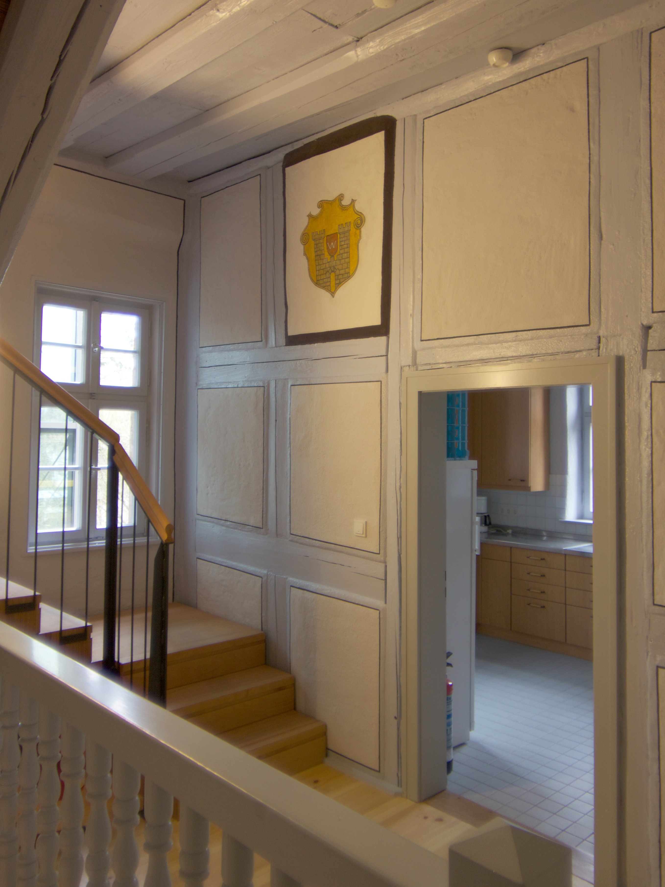 Staircase decorated with the coat of arms